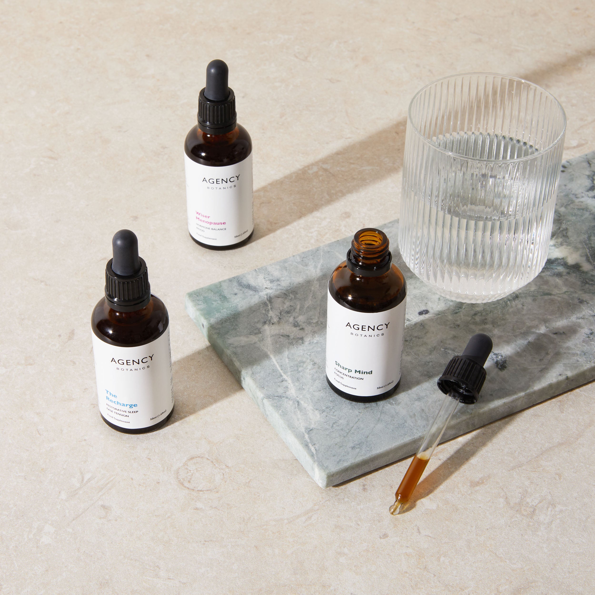 Organic herbal tincture and supplements from Agency Botanics for women's hormone health including herbs for perimenopause (vitex), focus and concentration (lion's mane), and sleep (passionflower).